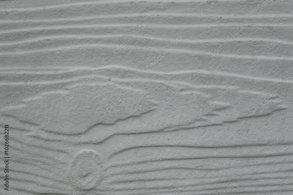 Obraz premium A wooden surface with a grainy texture. The wood appears to be unfinished, with a rough and uneven surface. Scene is somewhat rugged and natural, evoking a sense of raw, untouched beauty