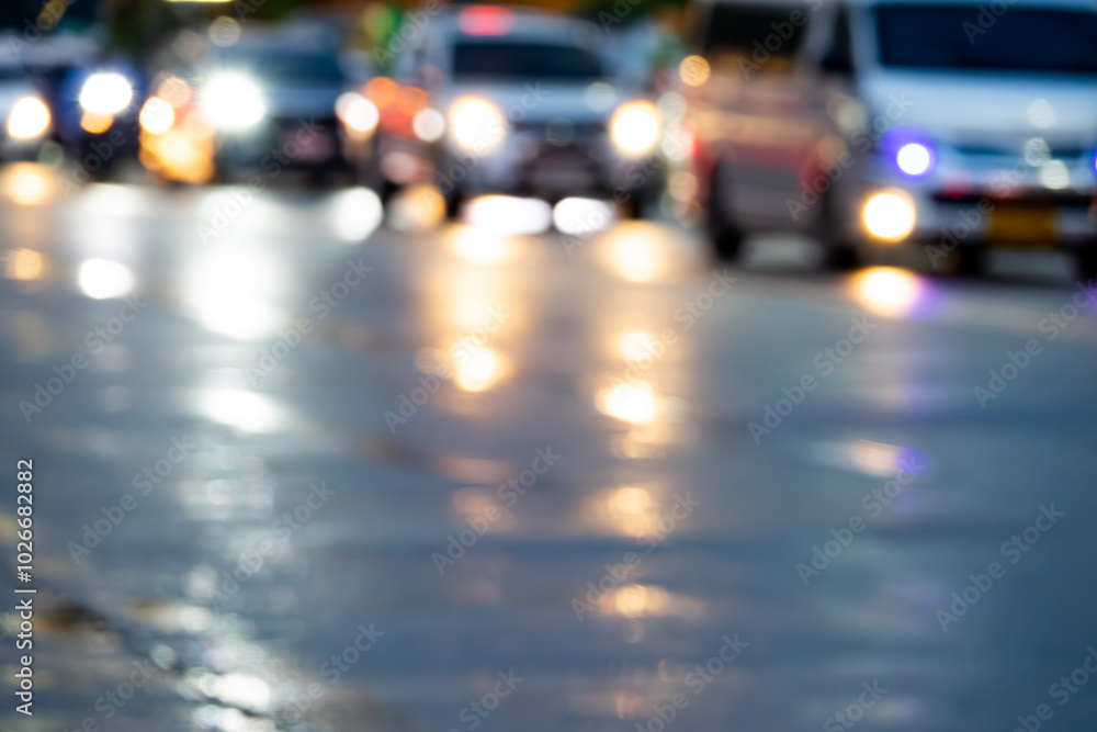 A blurry image of a busy street at night with cars and trucks. The lights from the vehicles create a hazy, dreamy effect A blurry image of a busy street at night with cars and trucks. The lights from the vehicles create a hazy, dreamy effect