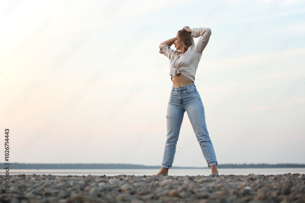 young woman posing near the sea young woman posing near the sea