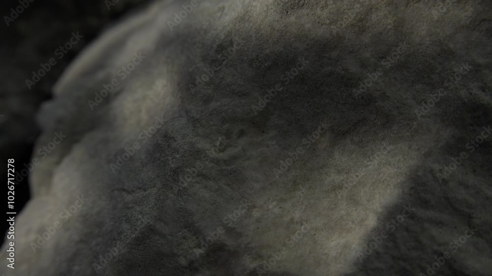 Soft shadowed surface of a weathered grey rock Soft shadowed surface of a weathered grey rock
