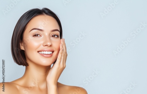 A beautiful Polish woman in her 40s with her hair styled in a sleek bob, smiling subtly and gently touching her face, skin care concept