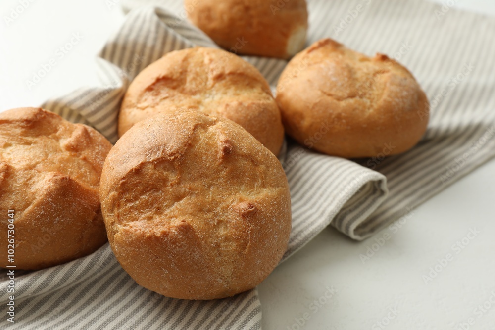 Homemade tasty buns on light table, closeup Homemade tasty buns on light table, closeup