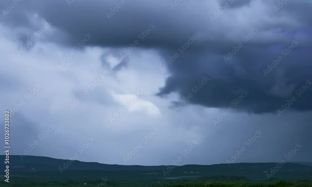 Tracking shot with storm clouds: The camera starts by following the movement of dark, menacing storm clouds, then tracks sideways to reveal the full sky and weather dynamics. Tracking shot with storm clouds: The camera starts by following the movement of dark, menacing storm clouds, then tracks sideways to reveal the full sky and weather dynamics.