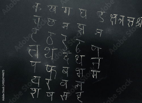 Cuadro en lienzo Hindi Script Handwritten by child on Blackboard as Learning to write with Transl