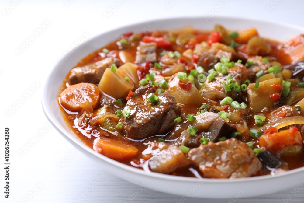 Delicious stew with vegetables in bowl on table, closeup Delicious stew with vegetables in bowl on table, closeup