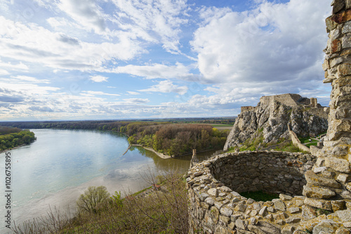 Two old bastions of Devin Castle, Danube river in background, slightly cloudy sky, Slovakia, wide angle lens