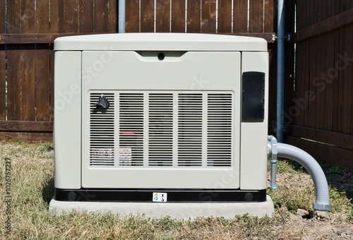 Standby home generator set in residential backyard emergency backup power supply.