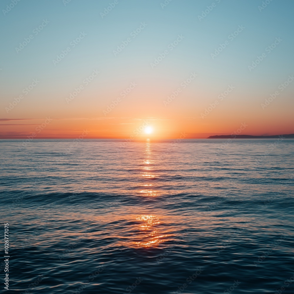 Fototapeta premium Vibrant sunset on the horizon casting reflections on tranquil ocean waters creating a captivating serene sunset view.