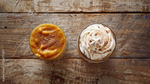 Cozy Autumn Beverages: Top View of Pumpkin Smoothie and Spice Latte with Whipped Cream on Rustic Wooden Background