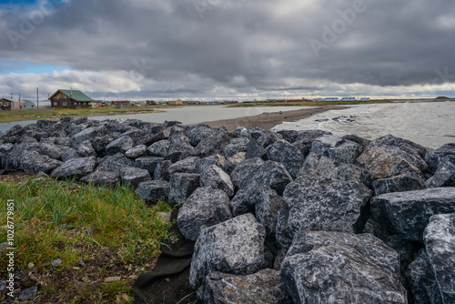 Stone sea barrier on the Arctic Ocean at Tuktoyaktuk, Northwest Territories, Canada photo