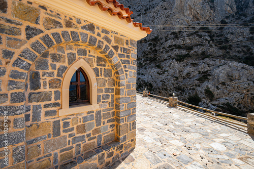 Detail of wall and window of rock-hewn stone church, Kotsifou valley, sunshine, Saint Nicholas Church, Greece, island of Crete, wide angle lens photo