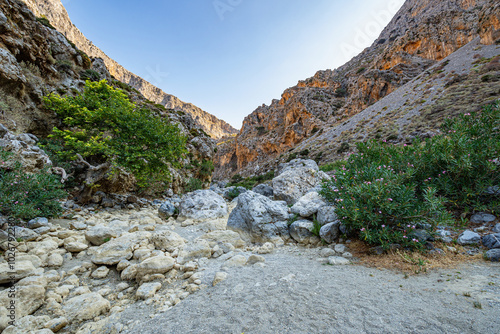 Barren high rocky mountains of Kourtaliotiko gorge with clear blue sky, Greece, Crete island, wide angle lens photo