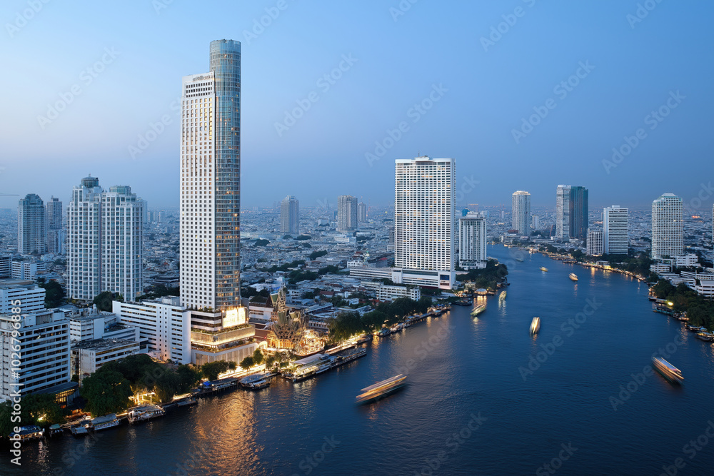 City skyline with river view during twilight in town, showcasing modern architecture City skyline with river view during twilight in town, showcasing modern architecture