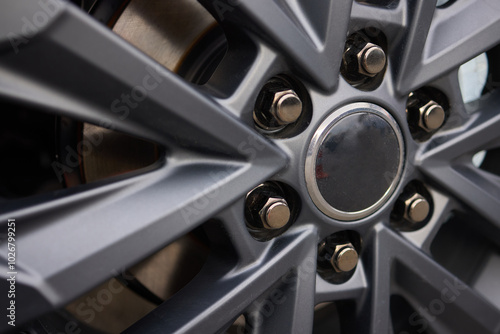 Detailed shot of a sleek black and silver alloy wheel on a motor vehicle