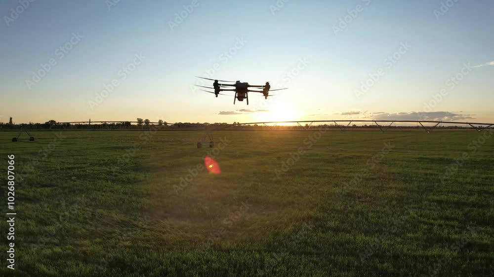 Agro drone works on the field. Field treatment with chemicals. Spraying pesticides against pests. Innovations in the agricultural sector.