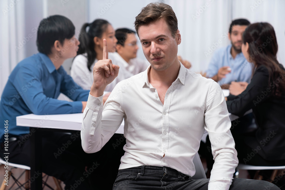 Obraz premium Confidence and happy smiling businessman portrait with background of his colleague and business team working in office. Office worker teamwork and positive workplace concept. Prudent
