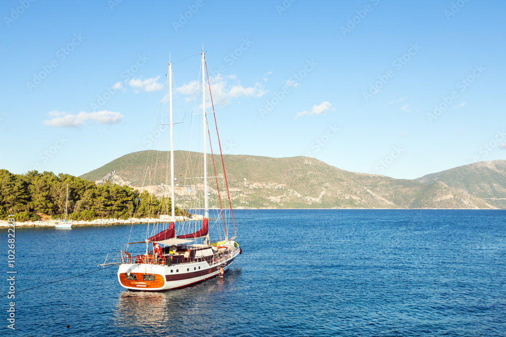 Sailboat in the harbour of Fiskardo, Kefalonia, Greek Islands, Greece Sailboat in the harbour of Fiskardo, Kefalonia, Greek Islands, Greece