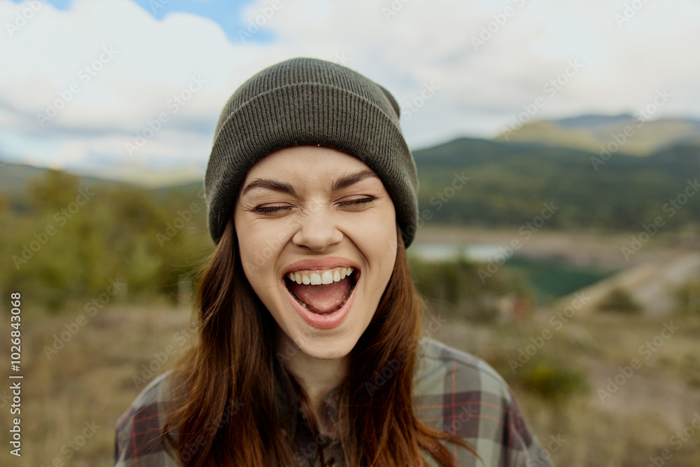 Woman amazed by the breathtaking view of a mountain lake travel and beauty in nature concept Woman amazed by the breathtaking view of a mountain lake travel and beauty in nature concept