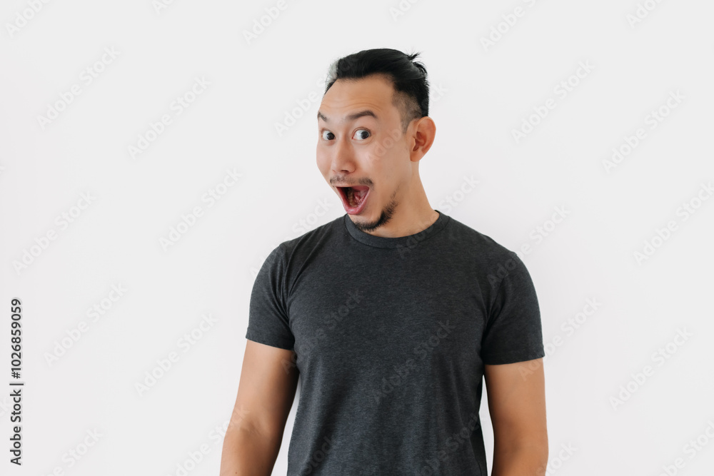 Surprised wow face Asian freelance man bun hair in black on white. Surprised wow face Asian freelance man bun hair in black on white.