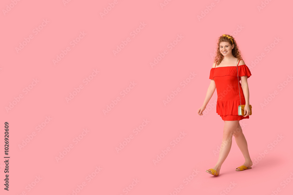 Beautiful young woman in stylish red dress with chain bag on pink background Beautiful young woman in stylish red dress with chain bag on pink background