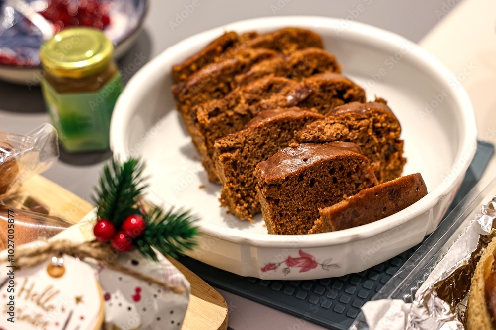 Sliced chocolate cake in a floral dish for serving Sliced chocolate cake in a floral dish for serving