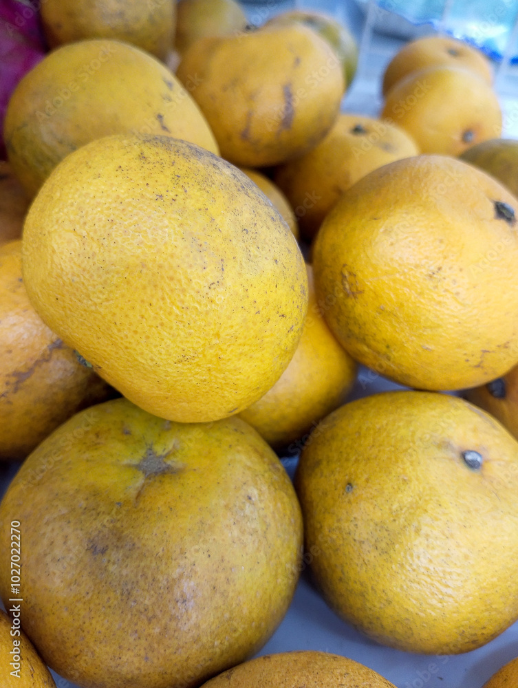 Heap of tangerine fruits, it's well known in Indonesia named as jeruk keprok Heap of tangerine fruits, it's well known in Indonesia named as jeruk keprok