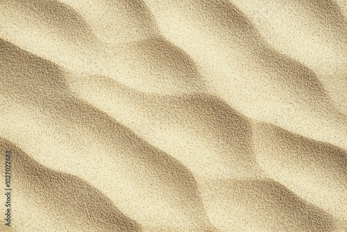 Textured sand patterns created by wind at a coastal area during daylight