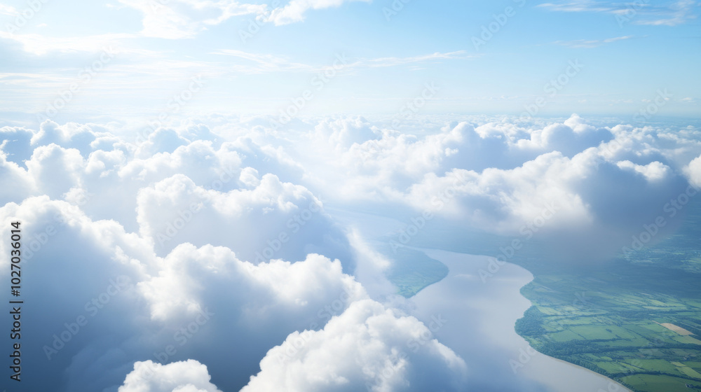 Fototapeta premium Flying through thick white clouds revealing green fields and rivers below
