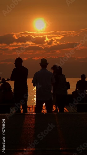 Wallpaper Mural Silhouetted Figures Against a Beautiful Sunset in the Evening Sky at the Waterfront Area Torontodigital.ca
