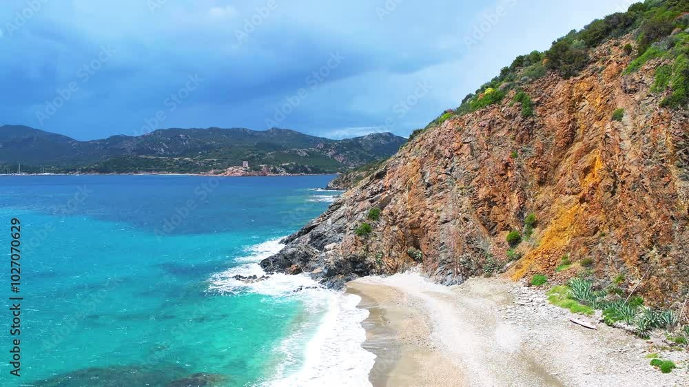 Torre del Budello watchtower tower by Teulada marina, rocky wild beach by cliffs on Sardinia island, Italy by Mediterranean sea Torre del Budello watchtower tower by Teulada marina, rocky wild beach by cliffs on Sardinia island, Italy by Mediterranean sea