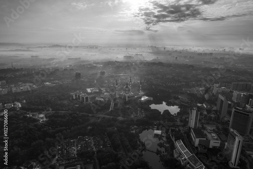 view of beautiful scenery Sultan Salahuddin Abdul Aziz Shah Mosque during sunrise photo