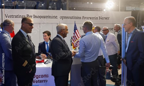 a of veterans attending a job fair, interacting with potential employers and exploring new career opportunities, Education and Retraining, Memorial Day, Independence Day