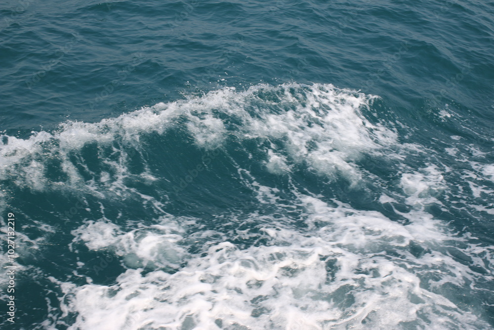 Turquoise ocean sea water white wave splashing deep blue sea. Bird eye view monster wave splash on rock. Tropical sea beach in summer seaside outdoor. Ocean island beautiful dramatic landscape. Turquoise ocean sea water white wave splashing deep blue sea. Bird eye view monster wave splash on rock. Tropical sea beach in summer seaside outdoor. Ocean island beautiful dramatic landscape.