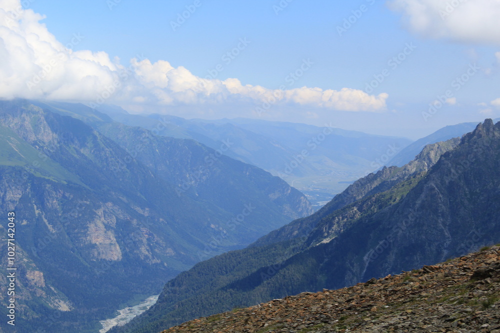 Naklejka premium mountain landscape with clouds