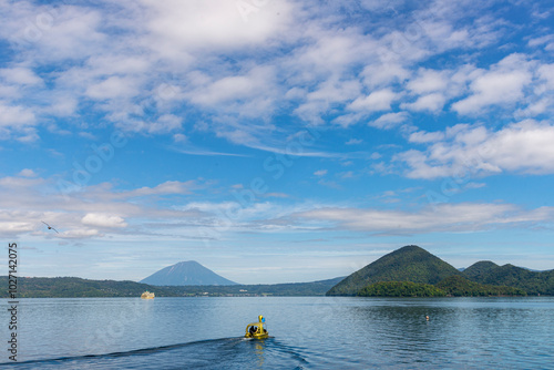 Lake Toya is a volcanic lake in Hokkaido, Japan, known for its tranquil waters and the surrounding natural beauty