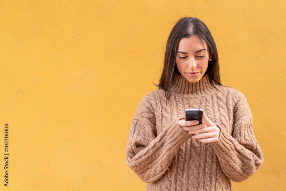 Young brunette woman at outdoors using mobile phone Young brunette woman at outdoors using mobile phone
