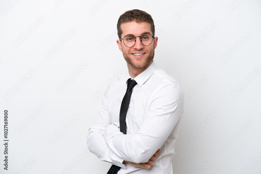 Young business caucasian man isolated on white background with arms crossed and looking forward Young business caucasian man isolated on white background with arms crossed and looking forward