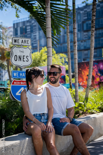 Young couple in love happily visiting Wynwood Walls in Miami