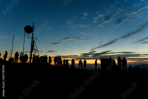 Silhouette many peoples at Noen Chang Suek, Pilok, Kanchanaburi, Thailand. photo