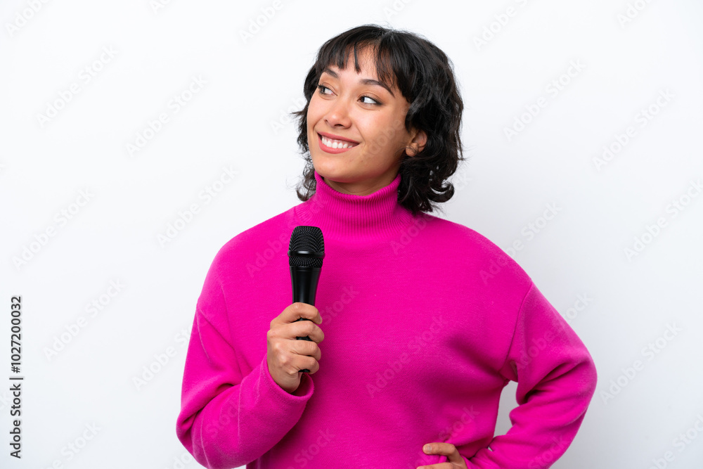 Young Argentinian singer woman isolated on white background thinking an idea while looking up Young Argentinian singer woman isolated on white background thinking an idea while looking up