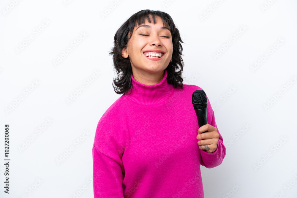 Young Argentinian singer woman isolated on white background laughing Young Argentinian singer woman isolated on white background laughing