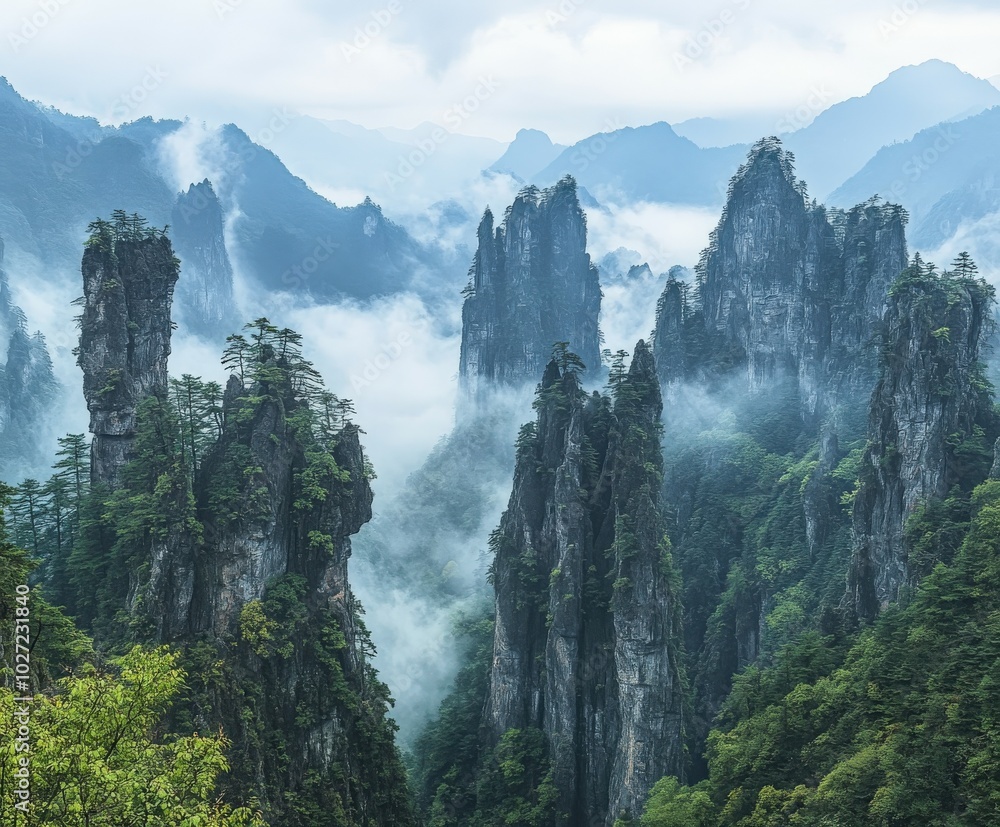 Misty morning envelops towering mountain peaks and lush greenery Misty morning envelops towering mountain peaks and lush greenery