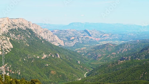 Gorropu canyon hiking trail path, hike to famous gorge in Sardinia with Sardinian mountains cliff nature forest landscape in summer of Italy photo