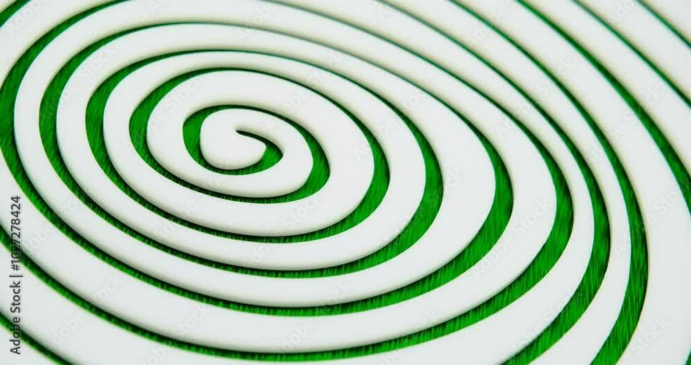 endless hypnotic irregular white spiral made of cast acrylic sheet on green background endless hypnotic irregular white spiral made of cast acrylic sheet on green background