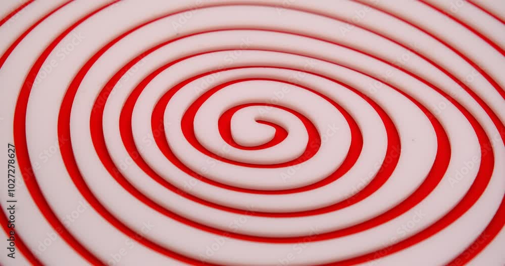 endless hypnotic irregular white spiral on red background endless hypnotic irregular white spiral on red background