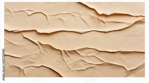 Close-up of irregularly torn textured beige paper layers creating an abstract pattern with shadows and highlights, showing a wavy, organic design. photo