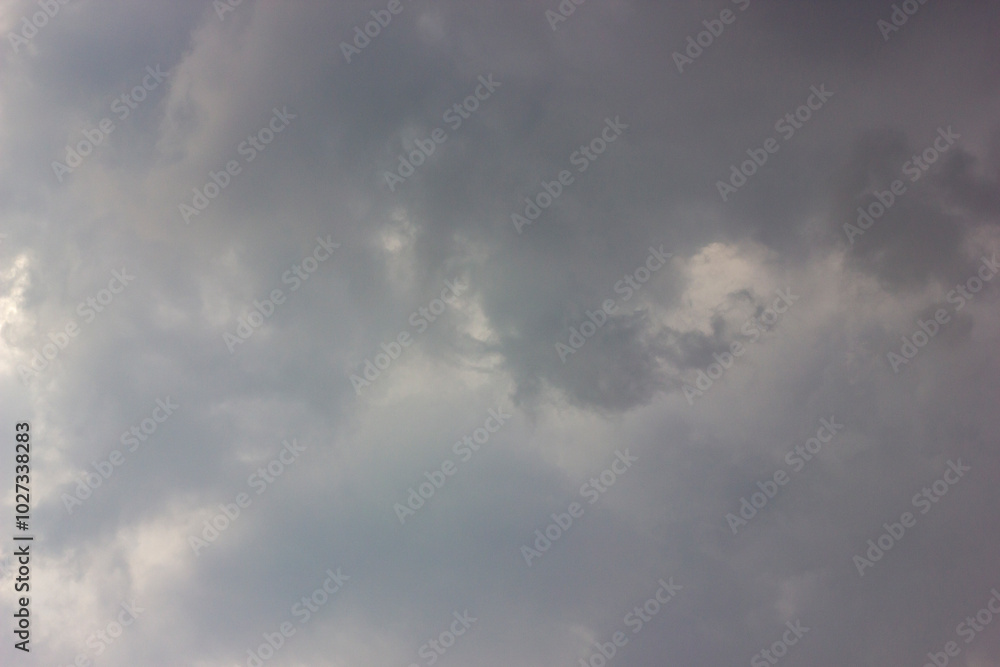 Stormy clouds background. Dark grey sky before the rain Stormy clouds background. Dark grey sky before the rain