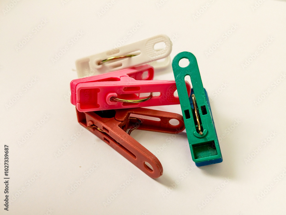colorful clothespins on an isolated white background colorful clothespins on an isolated white background
