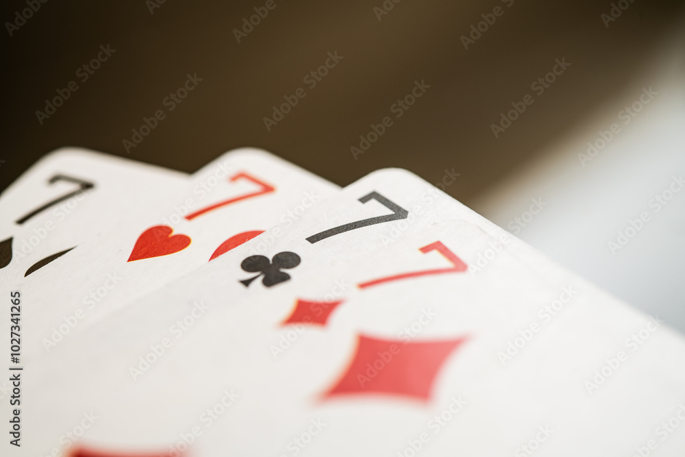 Four Lucky Seven Cards Displaying Unique Designs, Perfect for Gaming or Gambling Imagery and Symbolizing Fortune and Luck in Casino Environments Four Lucky Seven Cards Displaying Unique Designs, Perfect for Gaming or Gambling Imagery and Symbolizing Fortune and Luck in Casino Environments