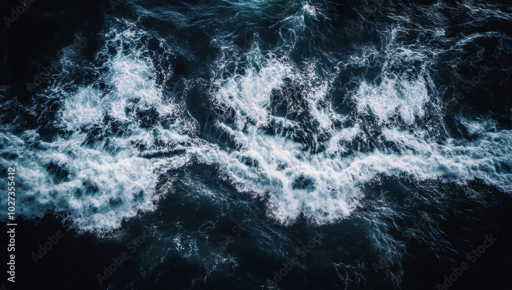 Waves churn and foam in the dark waters as the sun sets, casting a serene yet powerful atmosphere over the ocean Waves churn and foam in the dark waters as the sun sets, casting a serene yet powerful atmosphere over the ocean